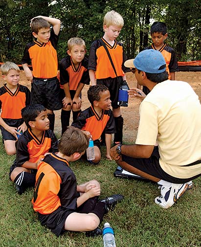 Volunteer soccer coach and team